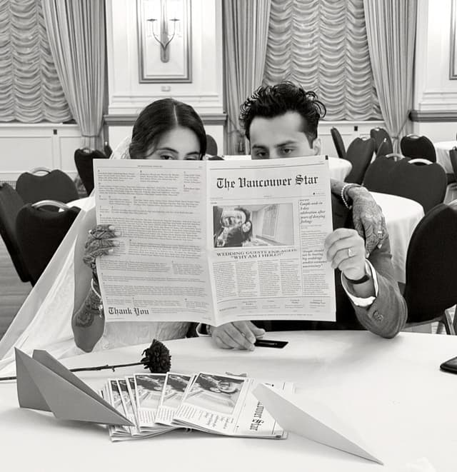 Raiya and Aalim at their wedding, reading a newspaper together